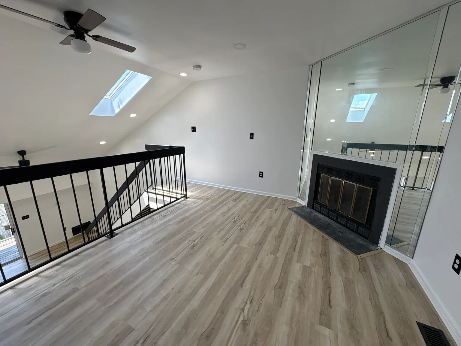 Kitchen renovation with quartz countertop, deep sink and black commercial-style faucet